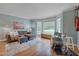 Spacious living room with bay window, hardwood floors, and sectional sofa at 6 Placid Ct, Durham, NC 27713