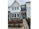 Two-story townhome with gray siding, white trim, and a front porch at 605 Hyperion Aly, Wake Forest, NC 27587