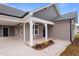 Front view of house with porch and landscaping at 806 S Magnolia Ave, Dunn, NC 28334