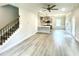 Open living room and kitchen area with luxury vinyl flooring at 211 Hopewell Branch Ct, Smithfield, NC 27577