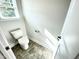Powder room with toilet and tile flooring at 211 Hopewell Branch Ct, Smithfield, NC 27577