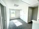 Bright bedroom with carpet, window, and double doors to closet at 211 Hopewell Branch Ct, Smithfield, NC 27577