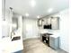 Modern kitchen with gray cabinets, quartz countertops, and stainless steel appliances at 211 Hopewell Branch Ct, Smithfield, NC 27577