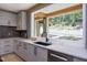 Kitchen with farmhouse sink and wood beams at 23930 Cherry, Chapel Hill, NC 27517