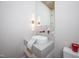Stylish bathroom with a floating vanity, marble countertop, and red accents at 23930 Cherry, Chapel Hill, NC 27517