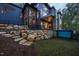 Modern home exterior with a retaining wall and infinity pool at 23930 Cherry, Chapel Hill, NC 27517