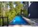 Luxury infinity pool with wooded backdrop at 23930 Cherry, Chapel Hill, NC 27517