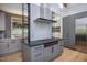 Sleek kitchen with custom cabinetry and gas range at 23930 Cherry, Chapel Hill, NC 27517