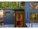 Modern home exterior with a deck and large windows at 23930 Cherry, Chapel Hill, NC 27517