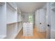 Large walk-in closet with ample shelving, hanging space, and center island at 23930 Cherry, Chapel Hill, NC 27517