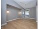 Bright bedroom with light hardwood floors, a ceiling fan, and large windows at 23930 Cherry, Chapel Hill, NC 27517