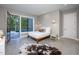 Modern basement bedroom with concrete floors, access to patio, and pool view at 23930 Cherry, Chapel Hill, NC 27517