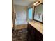 Elegant bathroom with double vanity, soaking tub, and decorative wall at 95 Crownside Dr, Four Oaks, NC 27524