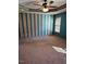 Bright bedroom featuring teal and beige striped wall at 95 Crownside Dr, Four Oaks, NC 27524