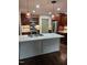 Kitchen boasts an island, stainless steel appliances, and hardwood floors at 95 Crownside Dr, Four Oaks, NC 27524