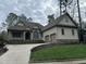Two-story house with stone accents and a three-car garage at 22005 Turner, Chapel Hill, NC 27517