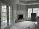 Gathering room under construction with fireplace and French doors at 22005 Turner, Chapel Hill, NC 27517