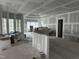 Kitchen under construction with an island and large windows at 22005 Turner, Chapel Hill, NC 27517