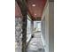 Stone porch with a wood ceiling and access to backyard at 22005 Turner, Chapel Hill, NC 27517