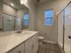 Bathroom boasts a vanity with quartz countertop and a large shower at 321 Murray Grey Ln, Wake Forest, NC 27587