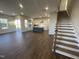 Open concept living room, kitchen, and stairs with hardwood floors at 321 Murray Grey Ln, Wake Forest, NC 27587