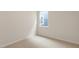 Bright bedroom with carpeted floor and large window at 1320 Jasmine View Way, Knightdale, NC 27545