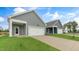 Attached garage with driveway and landscaping at 1309 White Verona Way, Knightdale, NC 27545