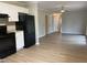Modern kitchen with white cabinets, black appliances, and flooring at 3407 S Mebane St, Burlington, NC 27215