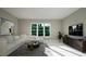Spacious living area with sectional sofa and large windows at 9417 Rawson Ave, Raleigh, NC 27613