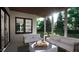 Spacious covered back porch with comfortable seating at 9417 Rawson Ave, Raleigh, NC 27613