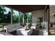 Relaxing covered back porch with seating area at 9417 Rawson Ave, Raleigh, NC 27613