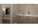 Laundry room with built-in cabinets and closet at 9417 Rawson Ave, Raleigh, NC 27613