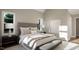 Spacious main bedroom with ample natural light and neutral decor at 9417 Rawson Ave, Raleigh, NC 27613