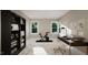 Home office or gym with built-in shelving and exercise bike at 9417 Rawson Ave, Raleigh, NC 27613