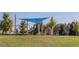 playground with swings, slides, climbing wall, and shade structure at 7 Blackhorn Ct, Pittsboro, NC 27312