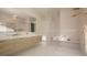 Luxurious bathroom with soaking tub, walk-in shower, and double vanity at 9413 Rawson Ave, Raleigh, NC 27613