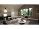 Elegant living room with a comfortable seating area and large windows at 9413 Rawson Ave, Raleigh, NC 27613