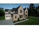 Stunning two-story home with a brick facade and modern design at 9413 Rawson Ave, Raleigh, NC 27613