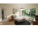 Spacious bedroom with large windows, wood floors, and a walk-in closet at 9413 Rawson Ave, Raleigh, NC 27613