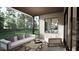 Spacious covered patio with comfortable seating and views of the lush green backyard at 9413 Rawson Ave, Raleigh, NC 27613