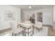Light filled home office with desk and comfortable seating at 515 W Lenoir St # 101, Raleigh, NC 27601
