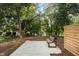 Relaxing patio with bench and wood privacy wall at 515 W Lenoir St # 101, Raleigh, NC 27601