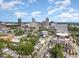 Aerial view showing the property's location in a vibrant urban neighborhood with city skyline in the background at 515 W Lenoir St # 101, Raleigh, NC 27601