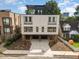 Modern two-unit building with rooftop decks and attached garages at 515 W Lenoir St # 101, Raleigh, NC 27601