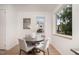 Bright dining area with a round table and four chairs at 515 W Lenoir St # 101, Raleigh, NC 27601
