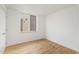 Simple bedroom with hardwood floors and a window at 515 W Lenoir St # 101, Raleigh, NC 27601