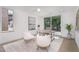 Bright home office features a desk, two chairs, and large window at 515 W Lenoir St # 101, Raleigh, NC 27601