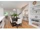 Modern dining room with hardwood floors and built-in shelving at 515 W Lenoir St # 101, Raleigh, NC 27601