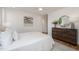 Spacious bedroom with a dresser and large windows at 515 W Lenoir St # 101, Raleigh, NC 27601