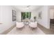 Bright home office features a desk, two chairs, and large window at 515 W Lenoir St # 101, Raleigh, NC 27601